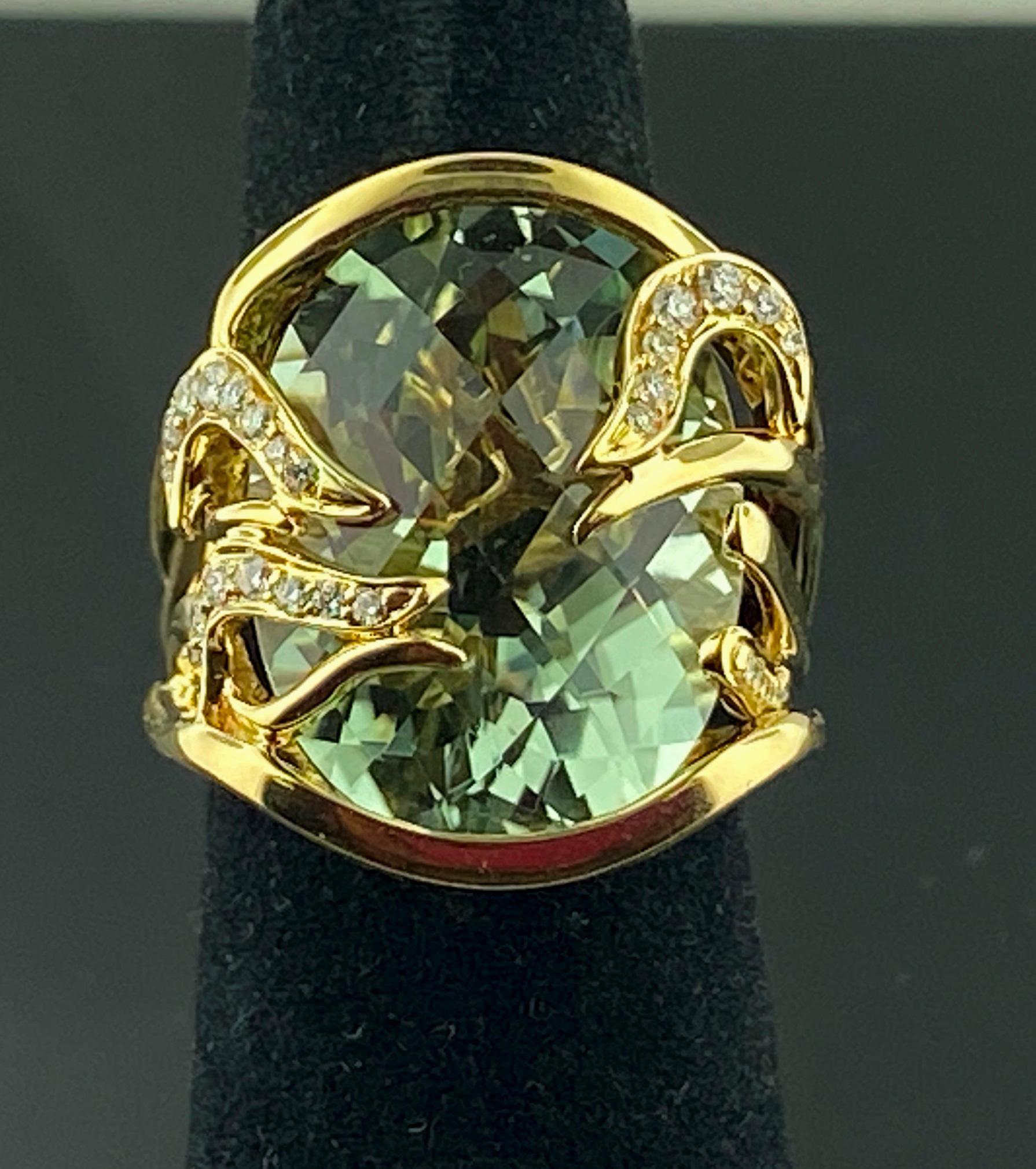 Set in 18 karat yellow gold, weighing 15 grams, is a 15.25 carat Aquamarine with 29 Round Brilliant Diamonds weighing 0.15 carats.  Ring Size is 6.75.