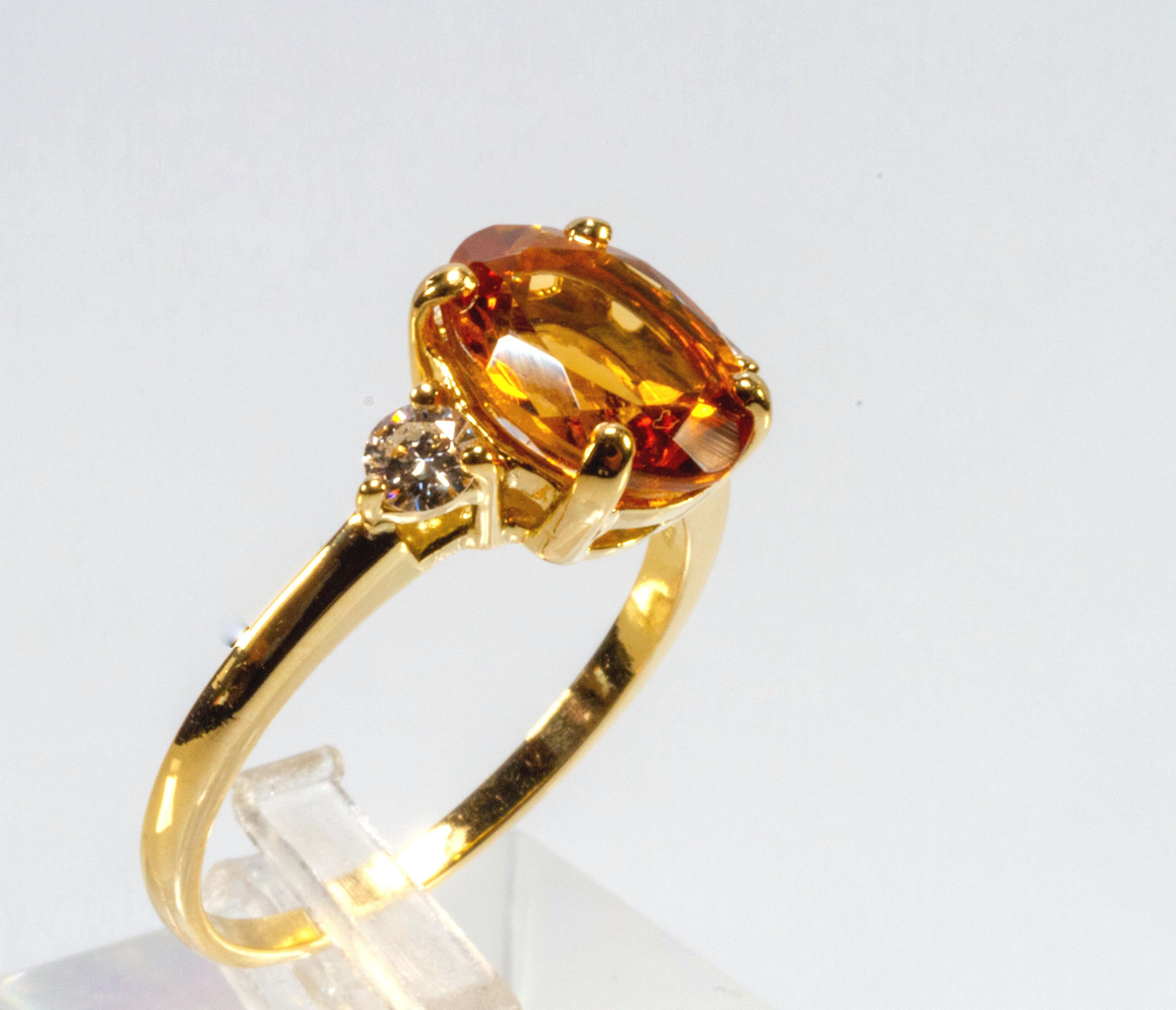 Pretty ring in 18-carat yellow gold with splendid faceted citrine enriched by two diamonds placed on both sides of the ring.
This citrine quartz was extracted from mines in Brazil, and is characterized by a bright yellow hue.
The two diamonds placed