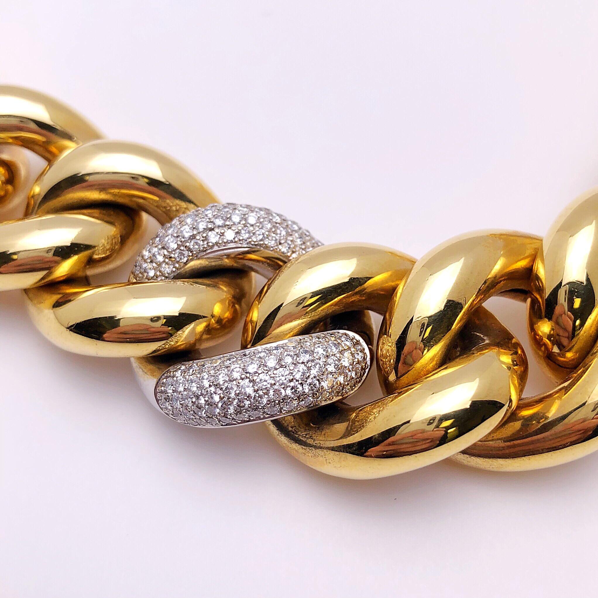 This fierce chunky gold bracelet is a definite statement piece. Twelve high polished yellow gold links and one beautifully set pave diamond link make up this classic gourmette link bracelet. 
The bracelet measures 8