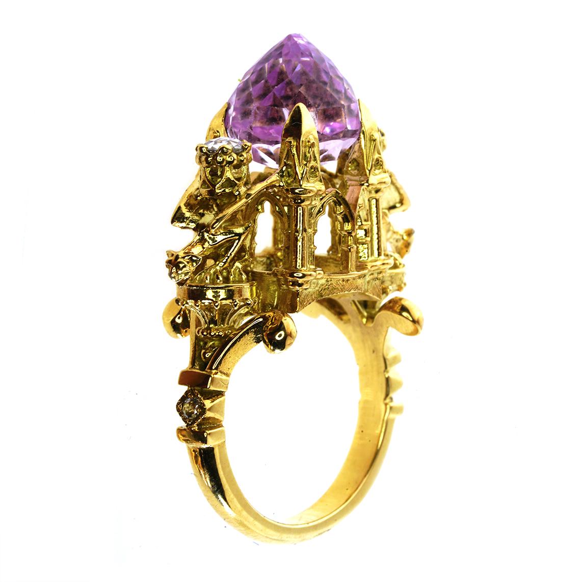 The Higher Divinity Ring is an exquisite piece. This incandescent ring is a one of a kind, luxurious masterpiece suitable for all divine entities

Handmade in 18kt yellow gold this incredible ring features a central, oval cut kunzite, claw set