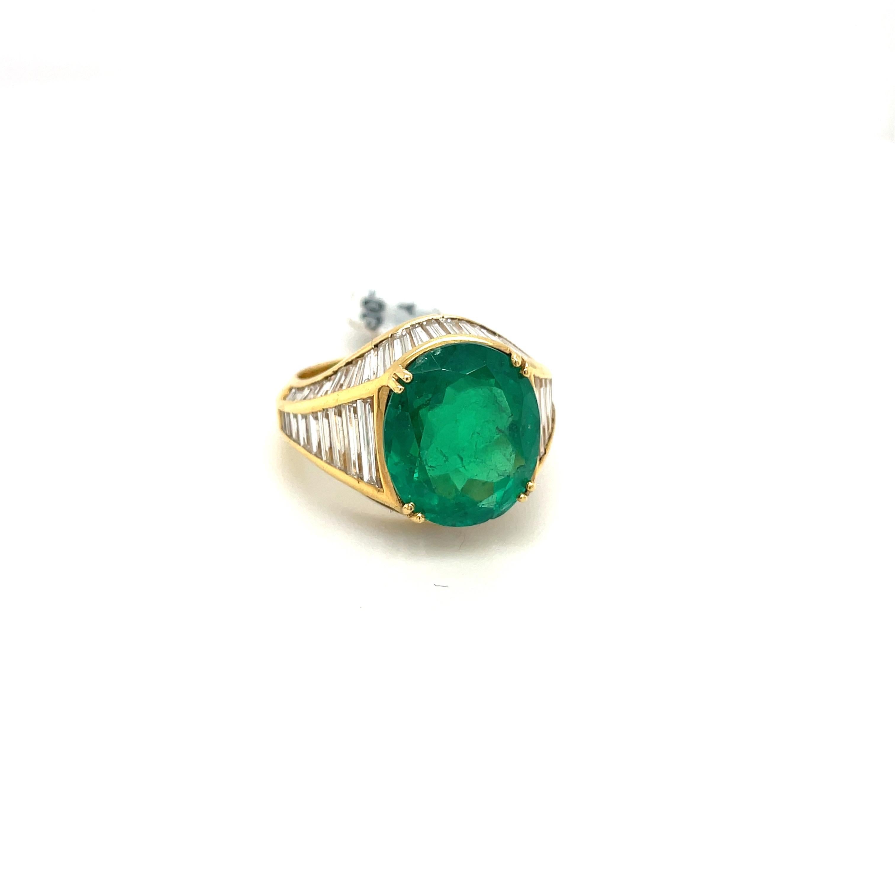 Contemporary 18KT Yellow Gold 6.00CT Oval Emerald 3.23CT Diamond Baguette Ring For Sale