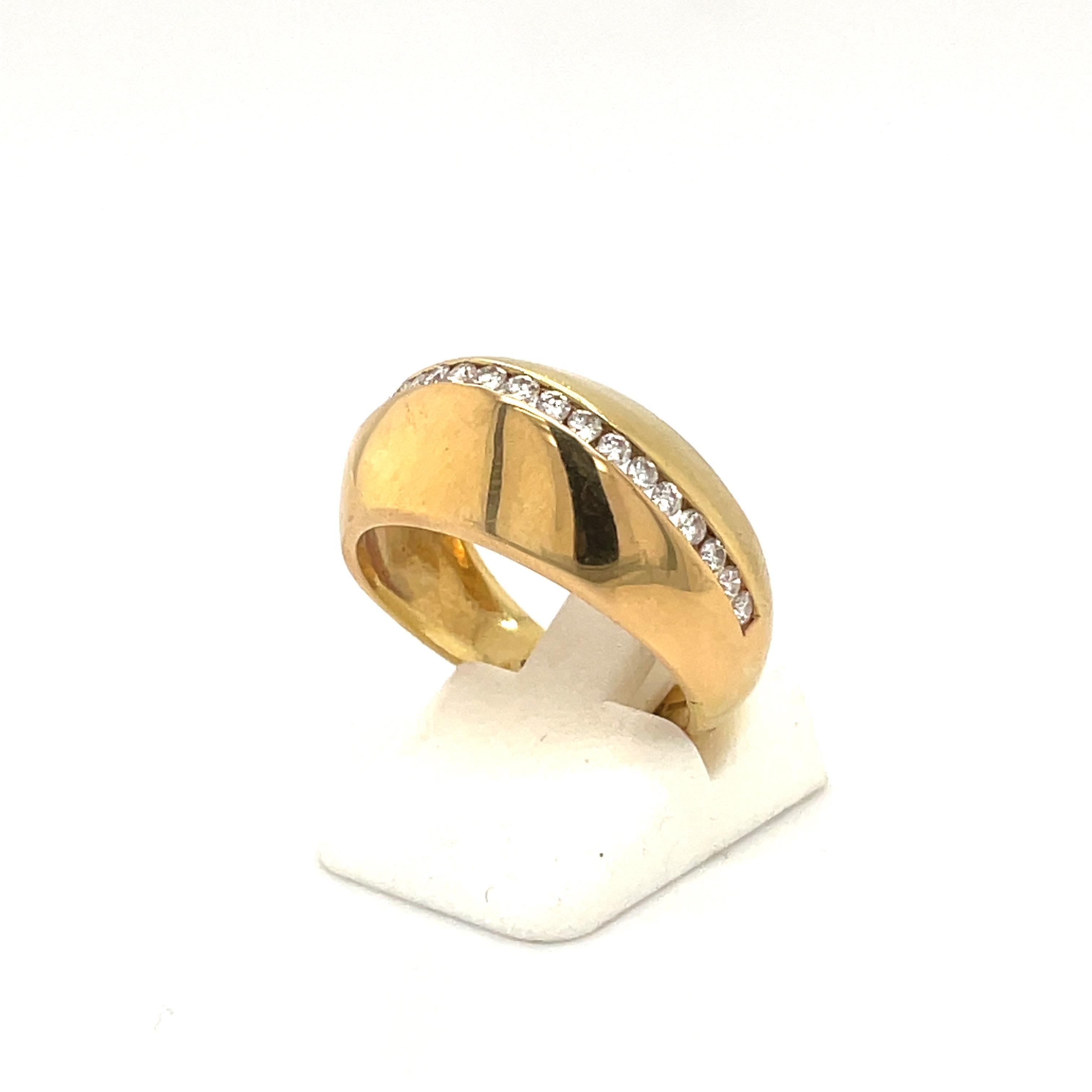 A classic dome style 18 karat yellow gold high polished dome ring. The center of the ring has a single row of round brilliant diamonds.
Total diamond weight 0.63 carats
Ring size 7.5 sizing may be available
Stamped 750