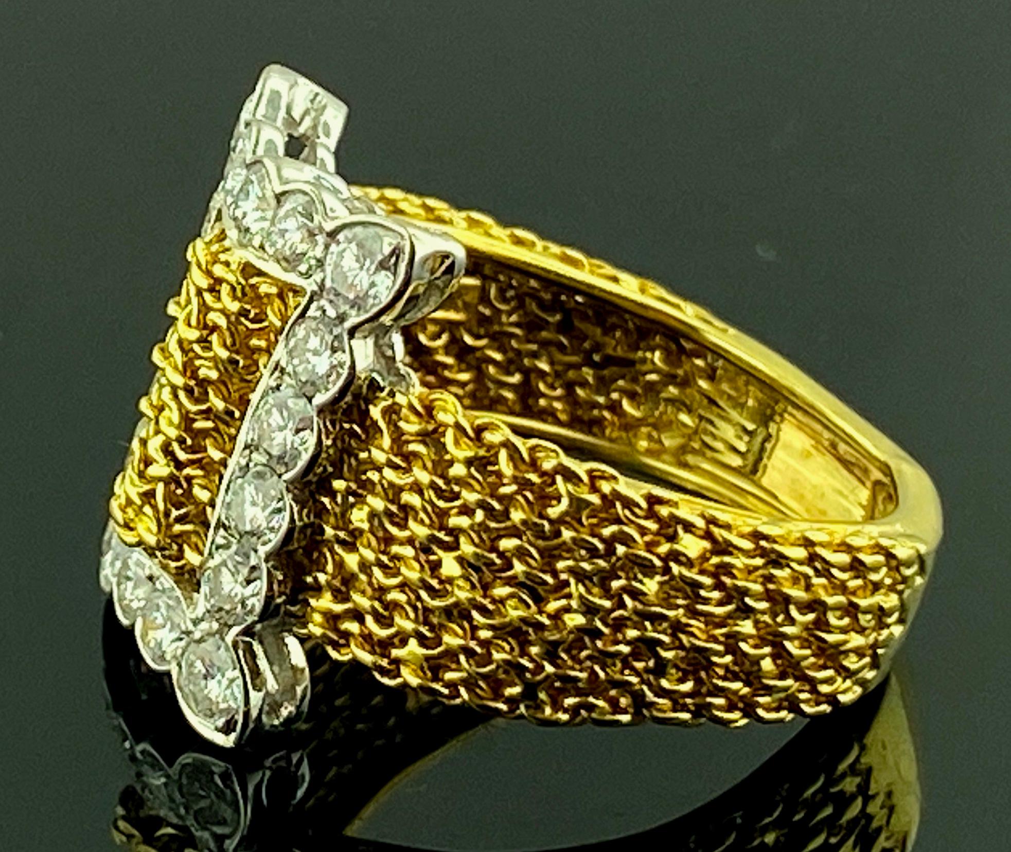 Set in 18 karat yellow gold are 18 round brilliant cut diamonds in a buckle fashion.  Total diamond weight is 1.00 carats.  Color is F-G, Clarity is VS.  Gold is 6 grams.  Ring size is 6.75.