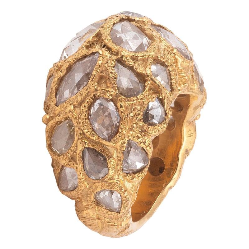18kt yellow gold and rose cut diamond approximately 10ct. Size 6 1/2

It's the famous samorodock ring, an iconic model by Codognato, which was given as a gift during the 1920s by Sergei Diaghilev to Coco Chanel and was the ring from which she drew