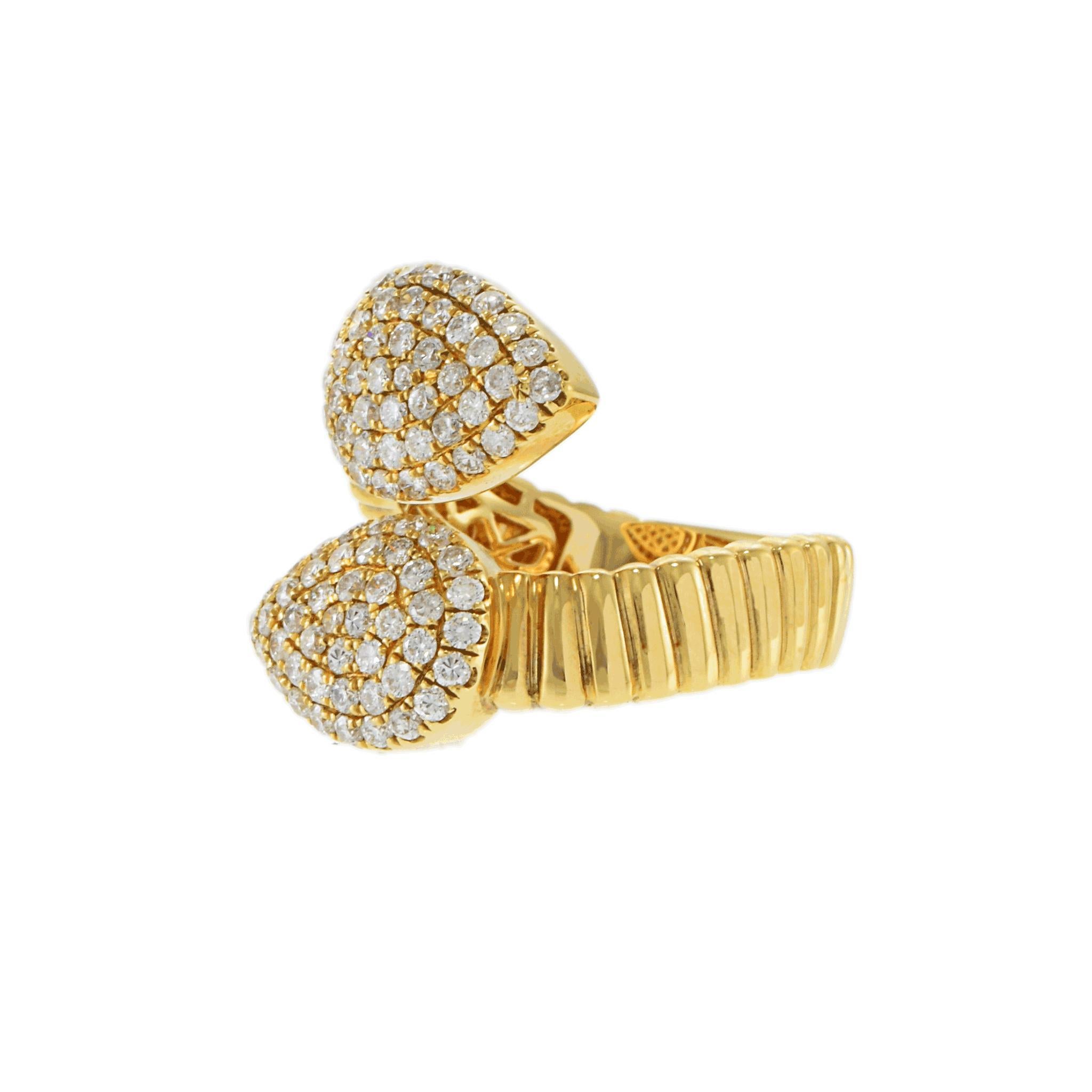 A symphony of curves, gold, and brilliance.

This striking ring showcases a dazzling array of round-cut diamonds, totaling 1.1 carats. The white stones, graded G in color and VS2 in clarity, are meticulously set in a captivating double teardrop