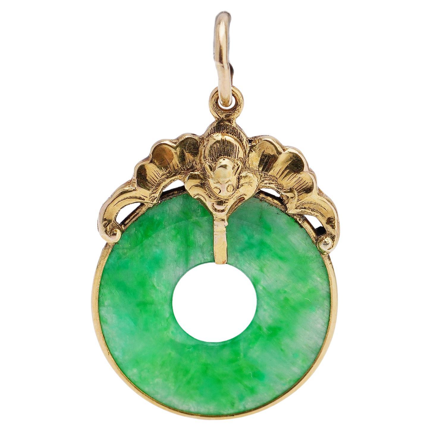 18kt. yellow gold and donut circle jade pendant