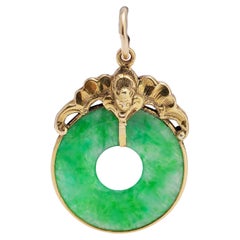 18kt. yellow gold and donut circle jade pendant