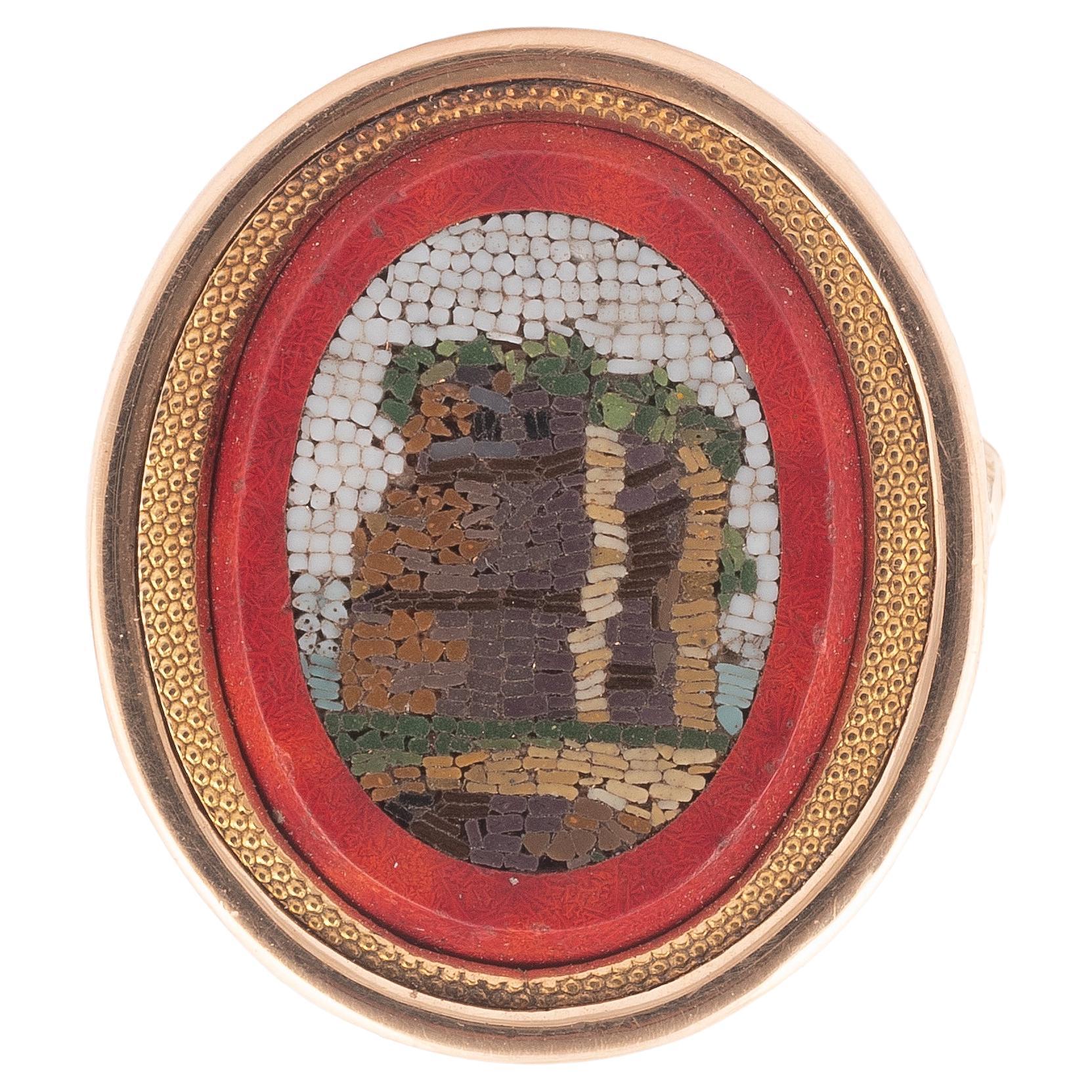 The oval panel inlaid with an oval micromosaic, depicting a classical architectural scene, yellow precious metal mounted, ring size 7.
