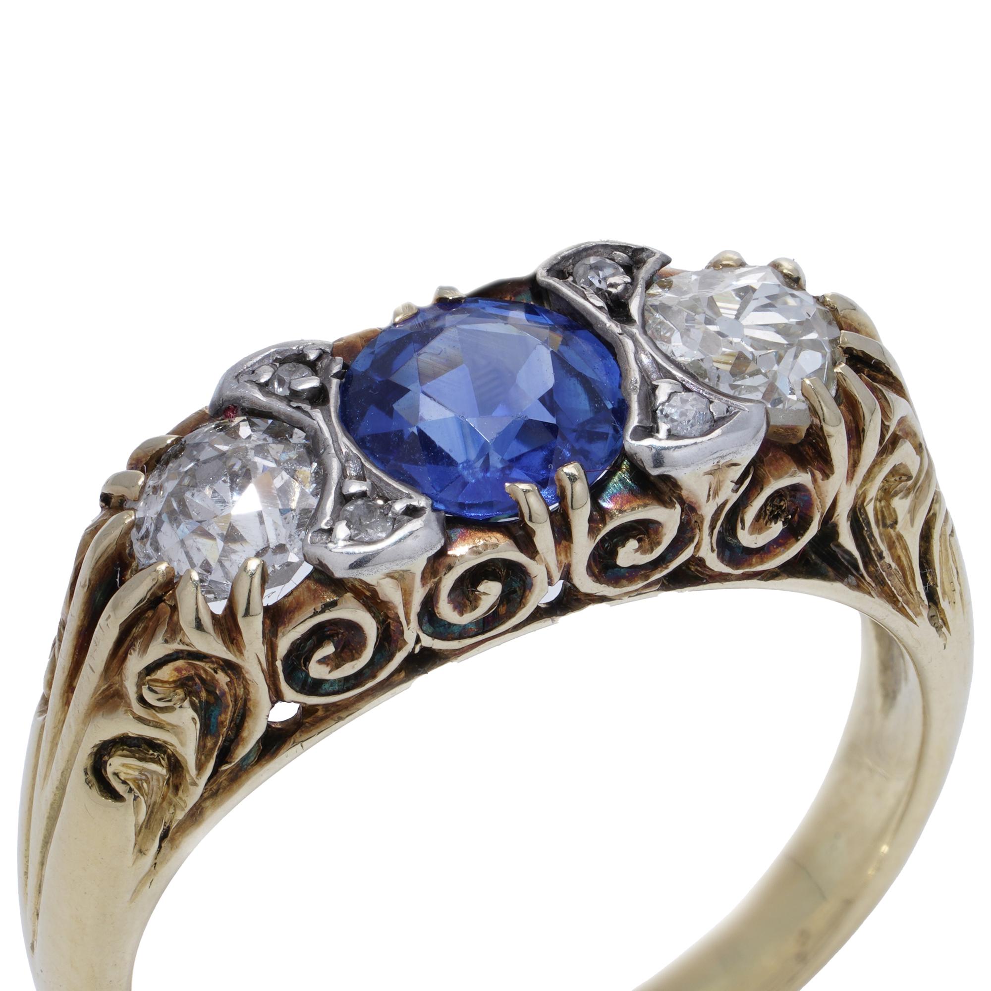18kt yellow gold and silver three - stone diamond and sapphire ring.

Finger Size: UK M 1/2 (EU 53 , US 6.75 )
Weight: 5.59 grams


Design:The ring is crafted in 18kt gold with silver settings for the gemstones.
Gemstones: The centerpiece of the
