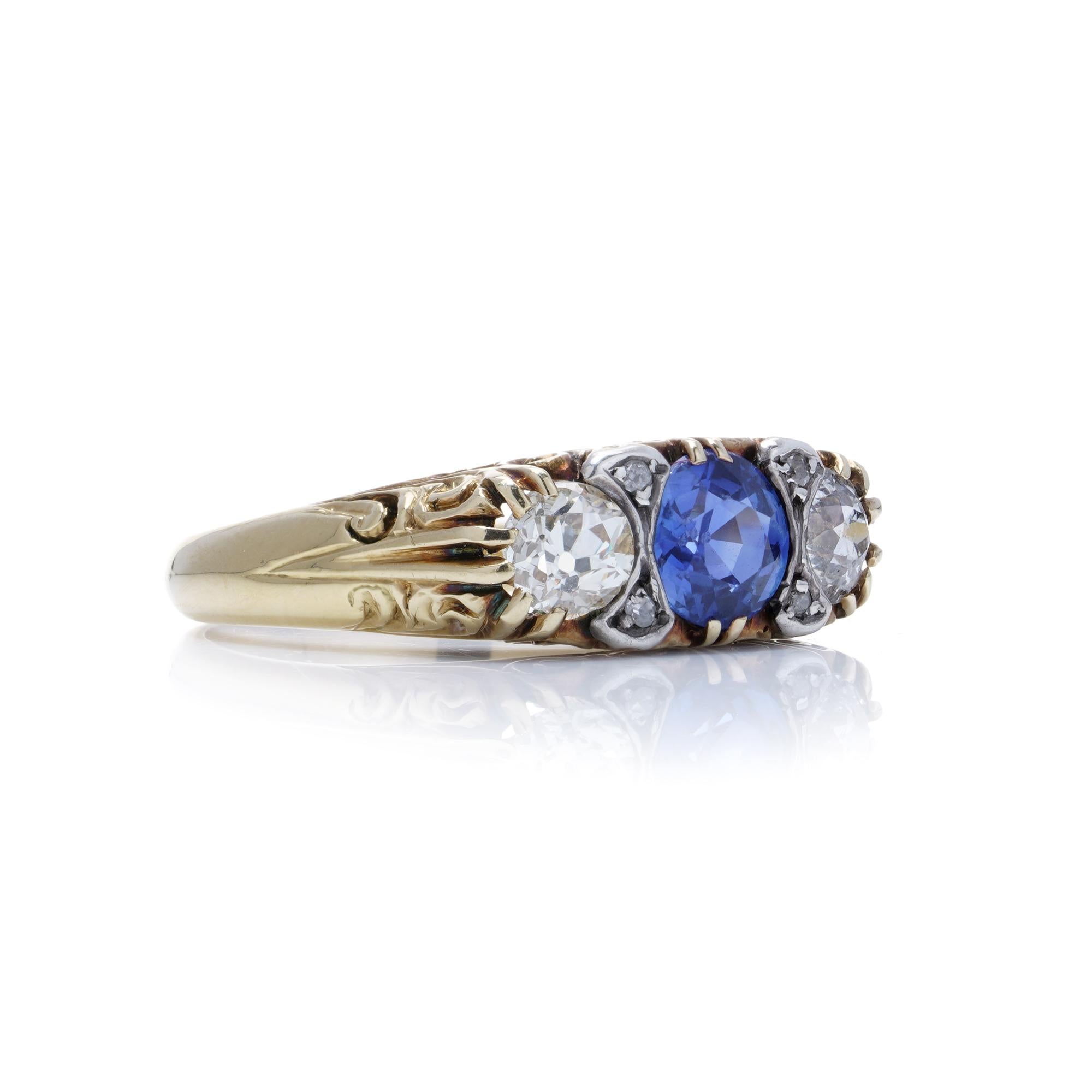 Women's 18kt yellow gold and silver three - stone diamond and sapphire ring For Sale