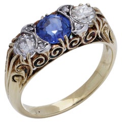 Anello in oro giallo 18kt e argento con tre pietre, diamanti e zaffiri