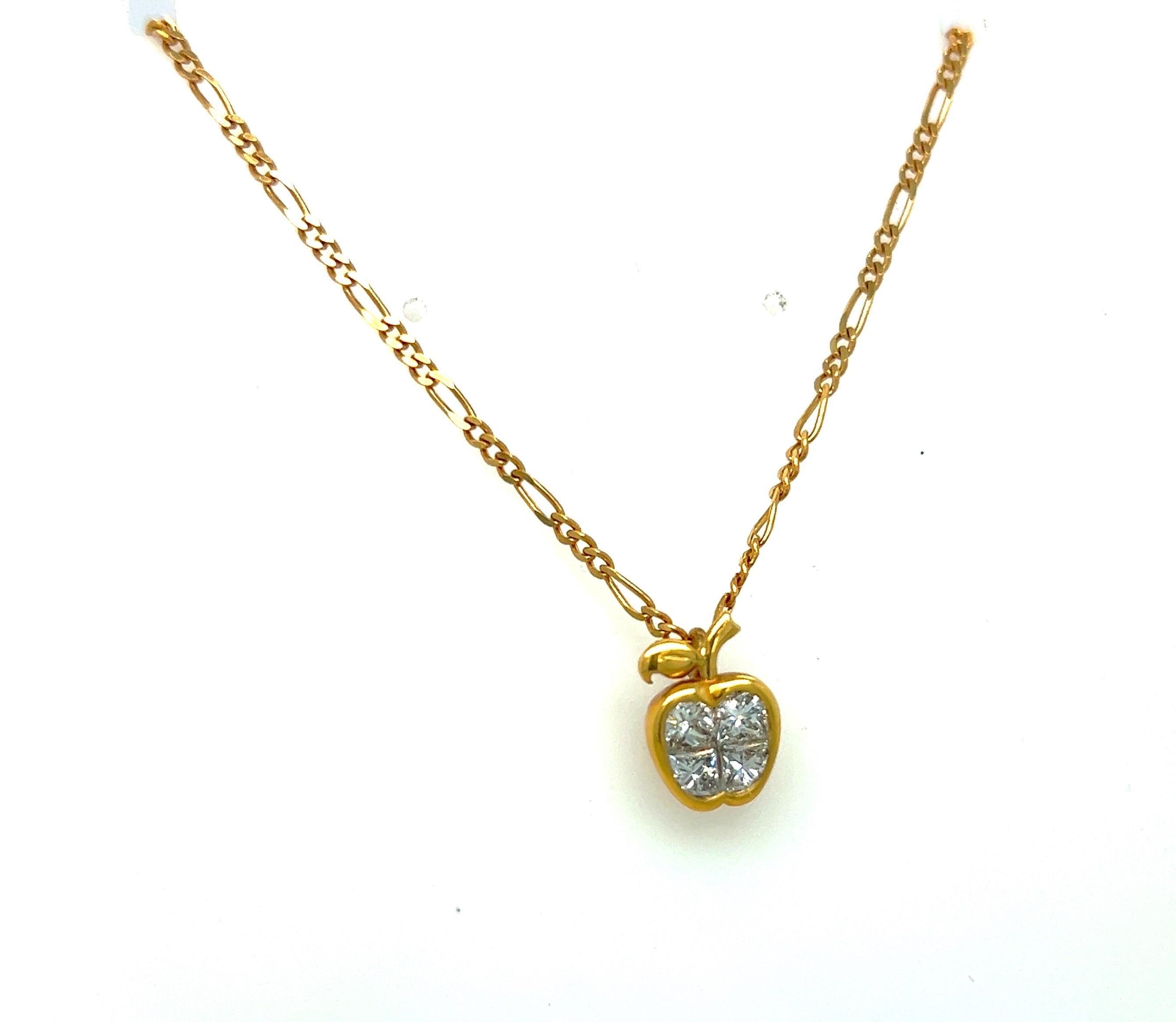 I Love New York
18 karat yellow gold apple pendant. The apple is invisibly set with 4 princess cut diamonds, weighing 0.85 carats. The apple measures 1/2