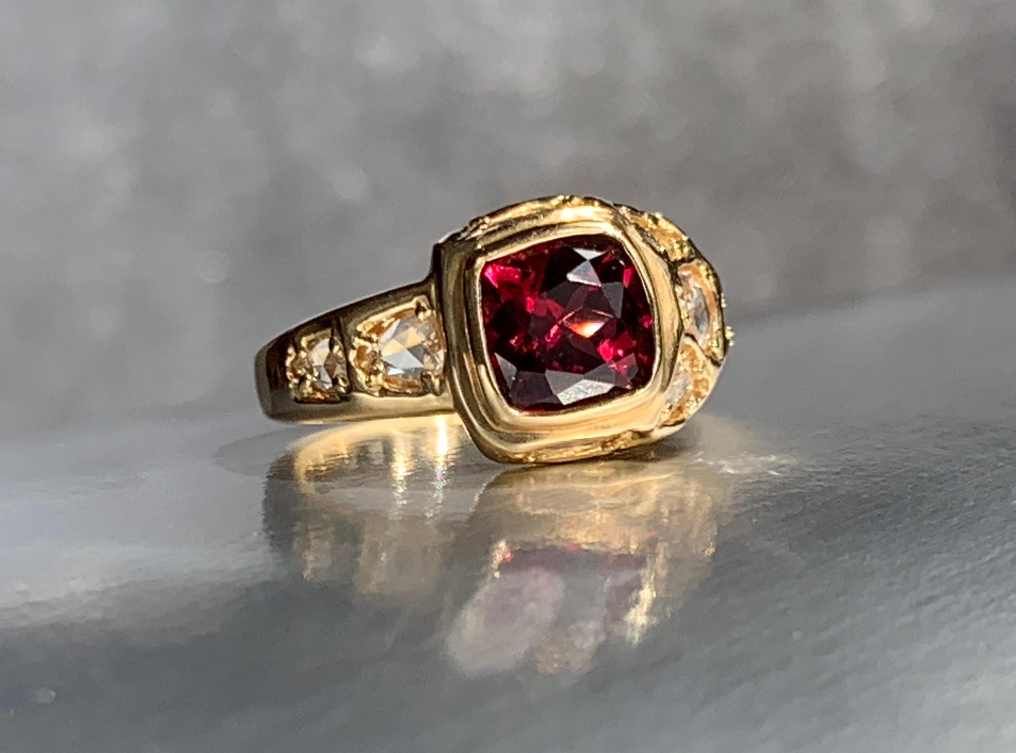The one-of-a-kind Garnet Treasure ring possesses a timeless sensibility. The intriguing composition incorporates fine white rose cut diamonds. The asymmetric design and novel placement of diamonds provides lasting interest.

18kt yellow gold
Garnet
