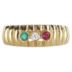 Anello a fascia in oro giallo 18kt con diamante, rubino e smeraldo