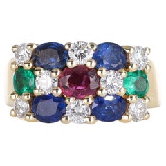 Anillo de oro amarillo de 18 quilates con diamantes, zafiros, rubíes y esmeraldas