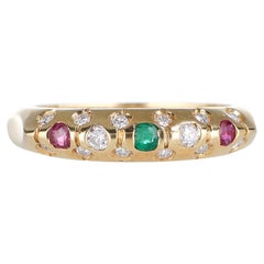 Anillo de oro amarillo de 18 quilates con esmeraldas, rubíes y diamantes