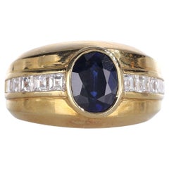 Anello a fascia in oro giallo 18 carati con zaffiro ovale e diamanti baguette
