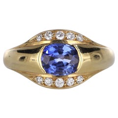 Anello a fascia in oro giallo 18kt con zaffiro e diamanti