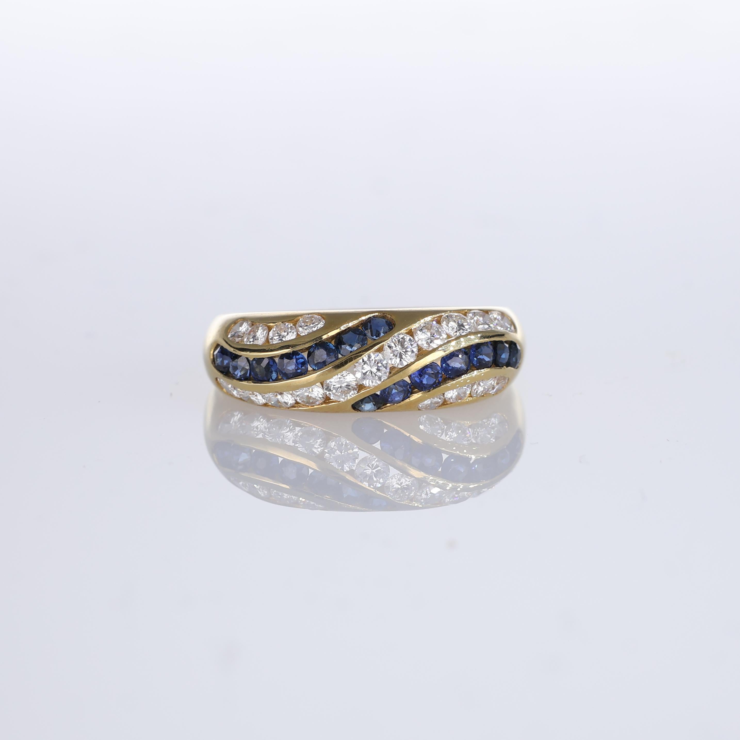 IMPORTANT NOTE:
✔ No additional costs will be added to this order.
✔ Shipping and customs duties are fully covered by us.
--------------------
An elegant 18kt yellow gold band ring featuring waves of blue sapphires interspersed with sparkling