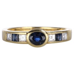 Bandring aus 18 Karat Gelbgold mit Saphiren und Diamanten