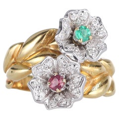 Anello a fascia in oro giallo 18kt con fiori di tormalina e diamanti