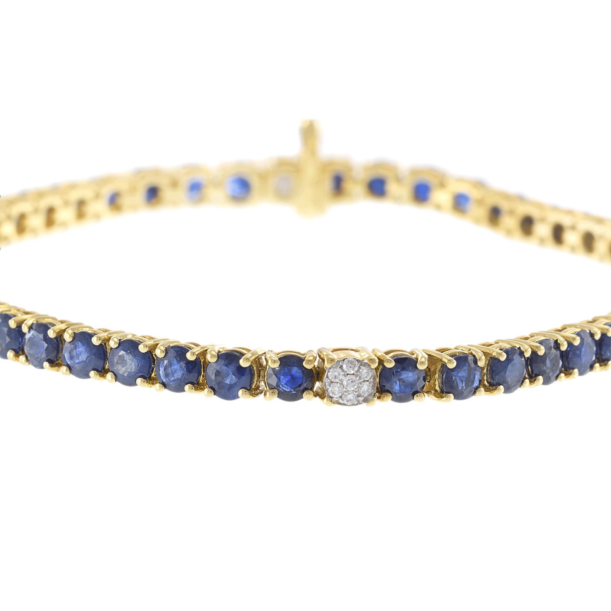 A stunning tennis bracelet crafted in 18k yellow gold, this elegant piece features a continuous line of round blue sapphires, weighing approximately 8.99ctw. The sapphires exhibit a deep blue hue, beautifully contrasted by the white round diamonds,