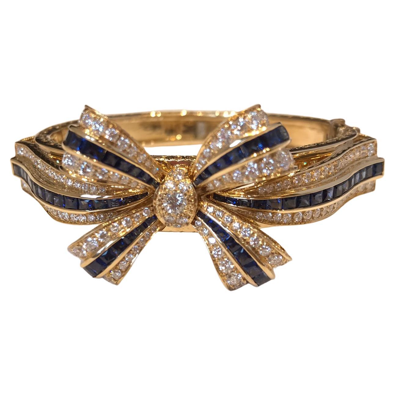 18KT yellow gold bracelet with blue sapphires and diamonds.