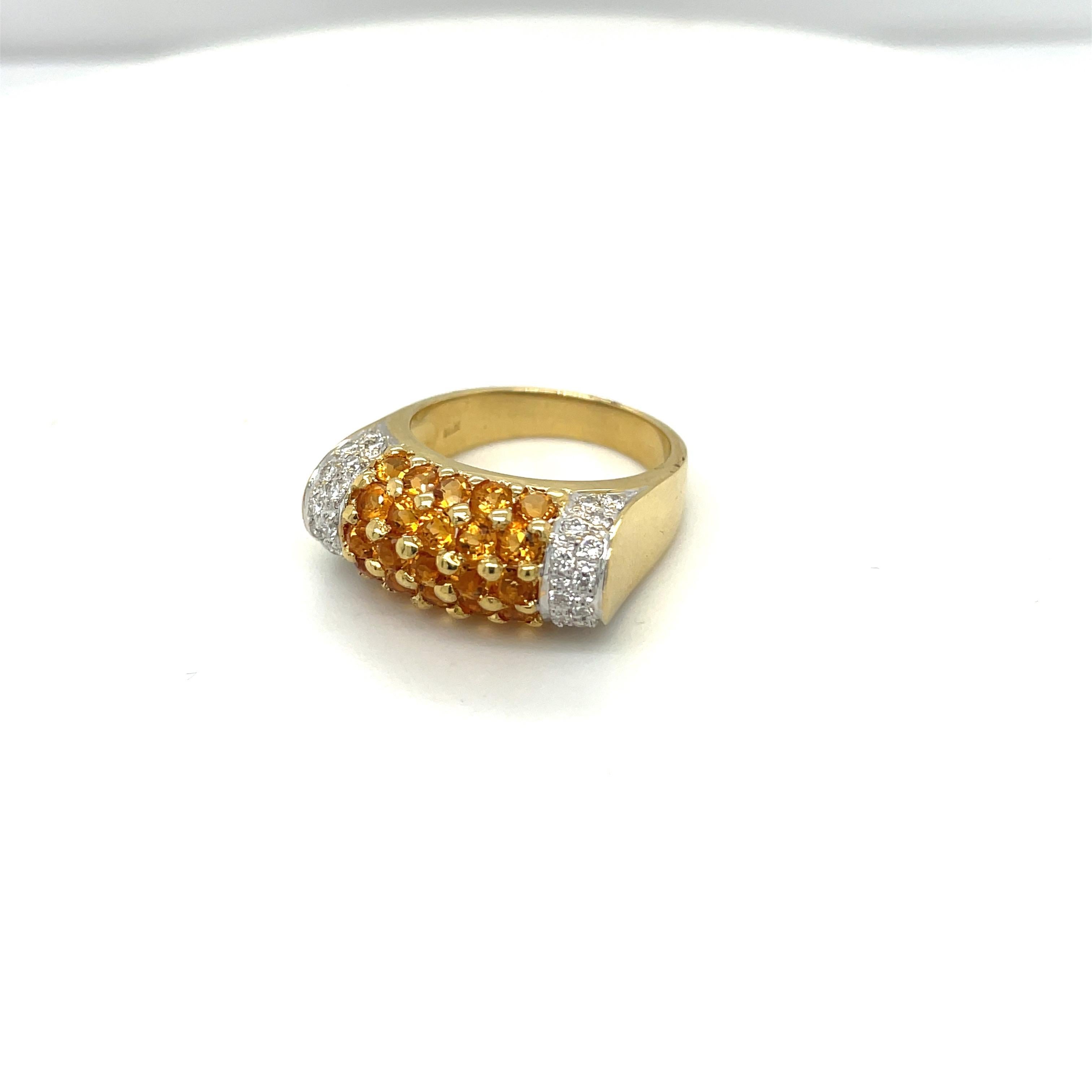 A very easy to wear 18 karat yellow gold ring. The ring is set wit with 25 round citrines weighing 1.50 carats and 30 round brilliant diamonds weighing 0.43 carats.
Finger size 7
Stamped 750 18K
Cellini Jewelers NYC