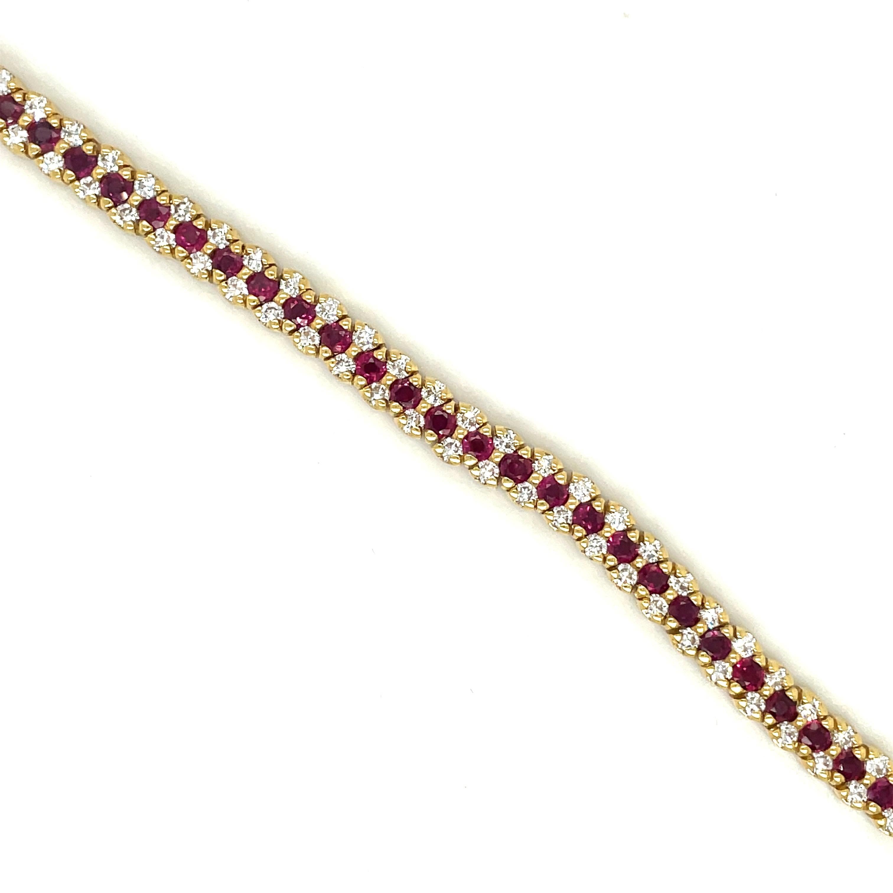 18 karat yellow gold tennis bracelet. This bracelet is designed with a center row of round brilliant cut rubies, and two rows of round brilliant cut diamonds. This is a timeless and classic bracelet. The bracelet measures 7