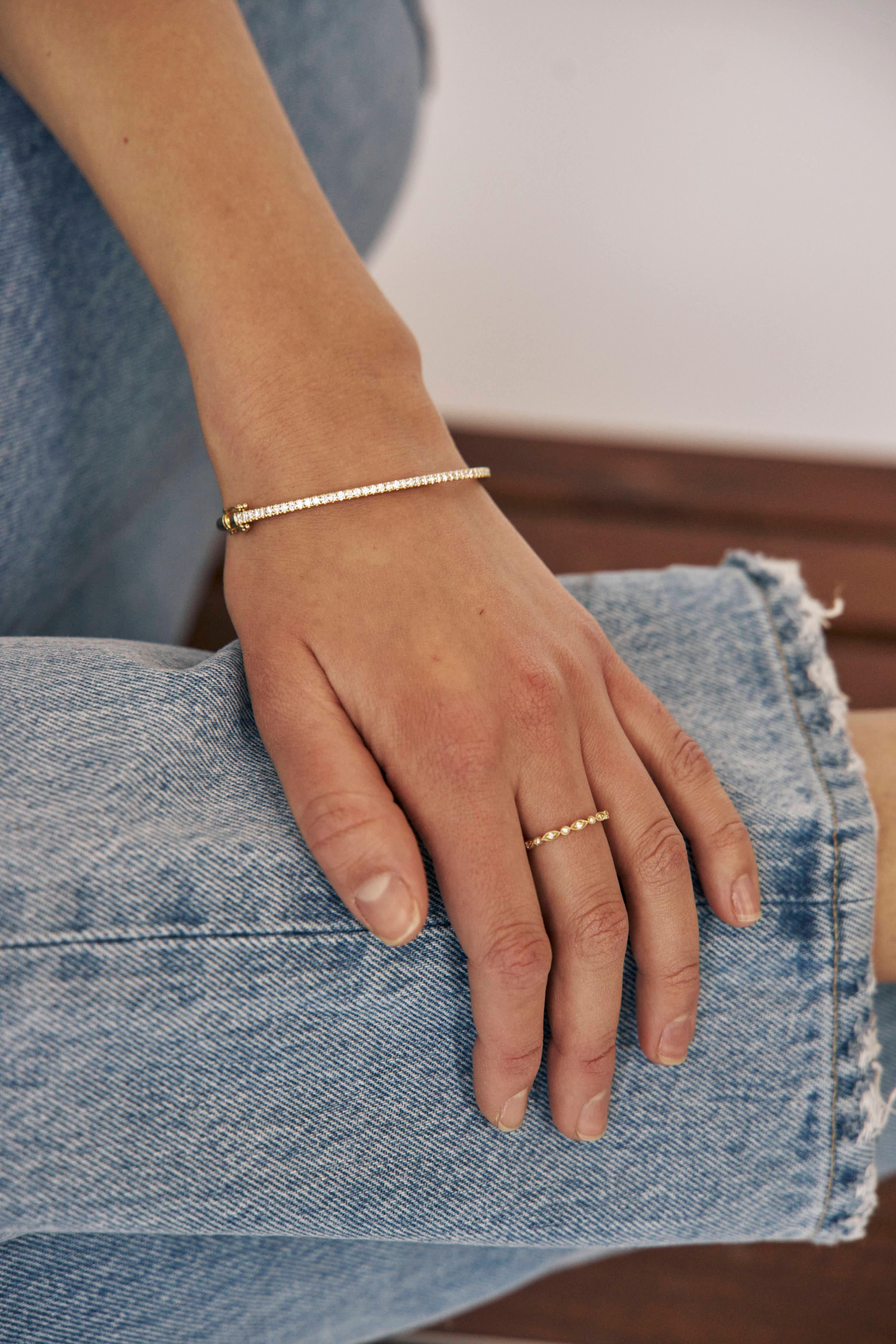 Timeless, elegant and sophisticated! A purchase you invest for a lifetime. The classic diamond bangle is a perfect look to wear alone or stack with your watch/other bracelets!

18kt Yellow Gold
Dimensions: 7