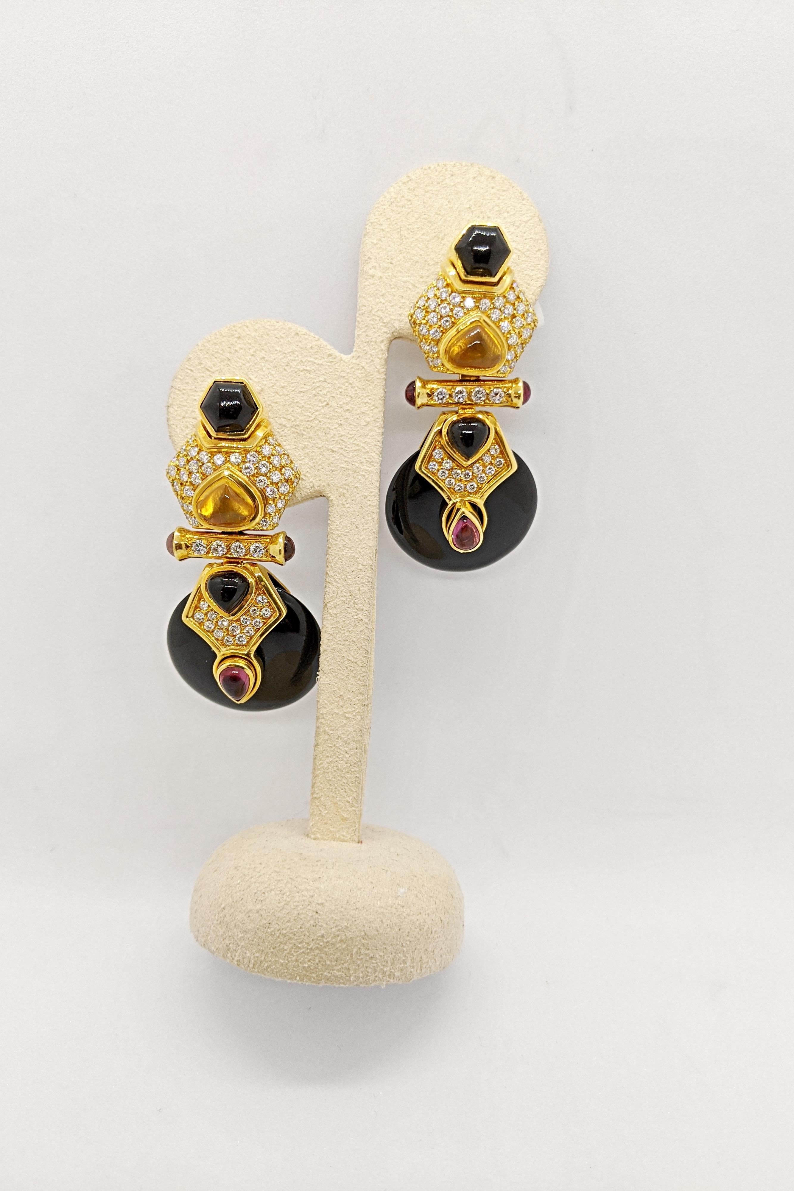1990's Chic ! These oh so classic 18 karat yellow gold earrings are designed with pave set diamonds and semi precious cabachon stones of citrine,  pink tourmaline, and black onyx. A black onyx disc hangs from the lower part of the earrings. The