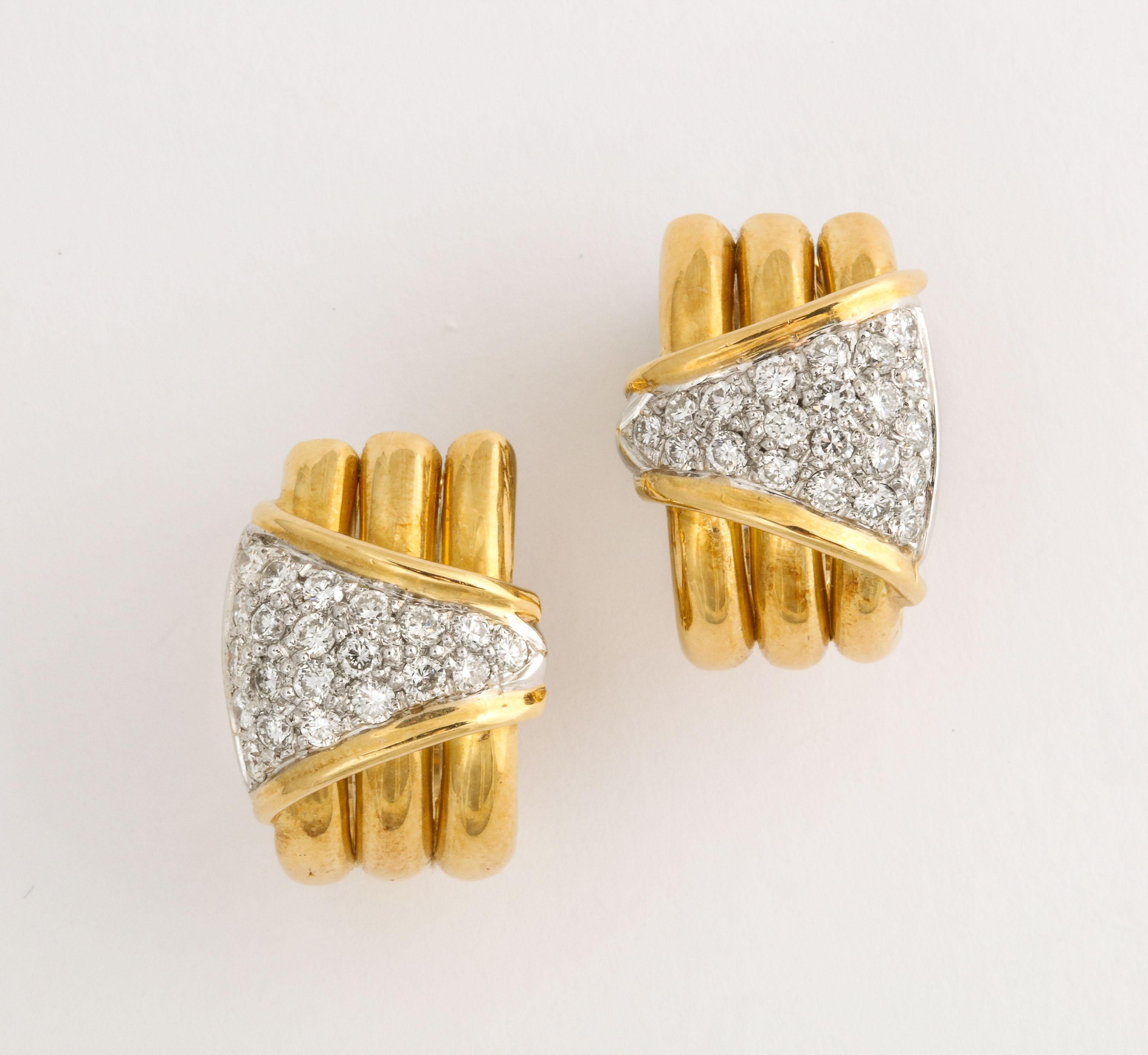 Pair of 18kt Yellow Gold  Clip on Diamond Earrings - withOmega back &  Post.  Tri Partite Hoop  with Opposing gold bordered Pave Diamond Triangular  Shapes. Marked 18kt and 750 / Italy - and Italian control Mark.  Very clean full cut Diamonds.