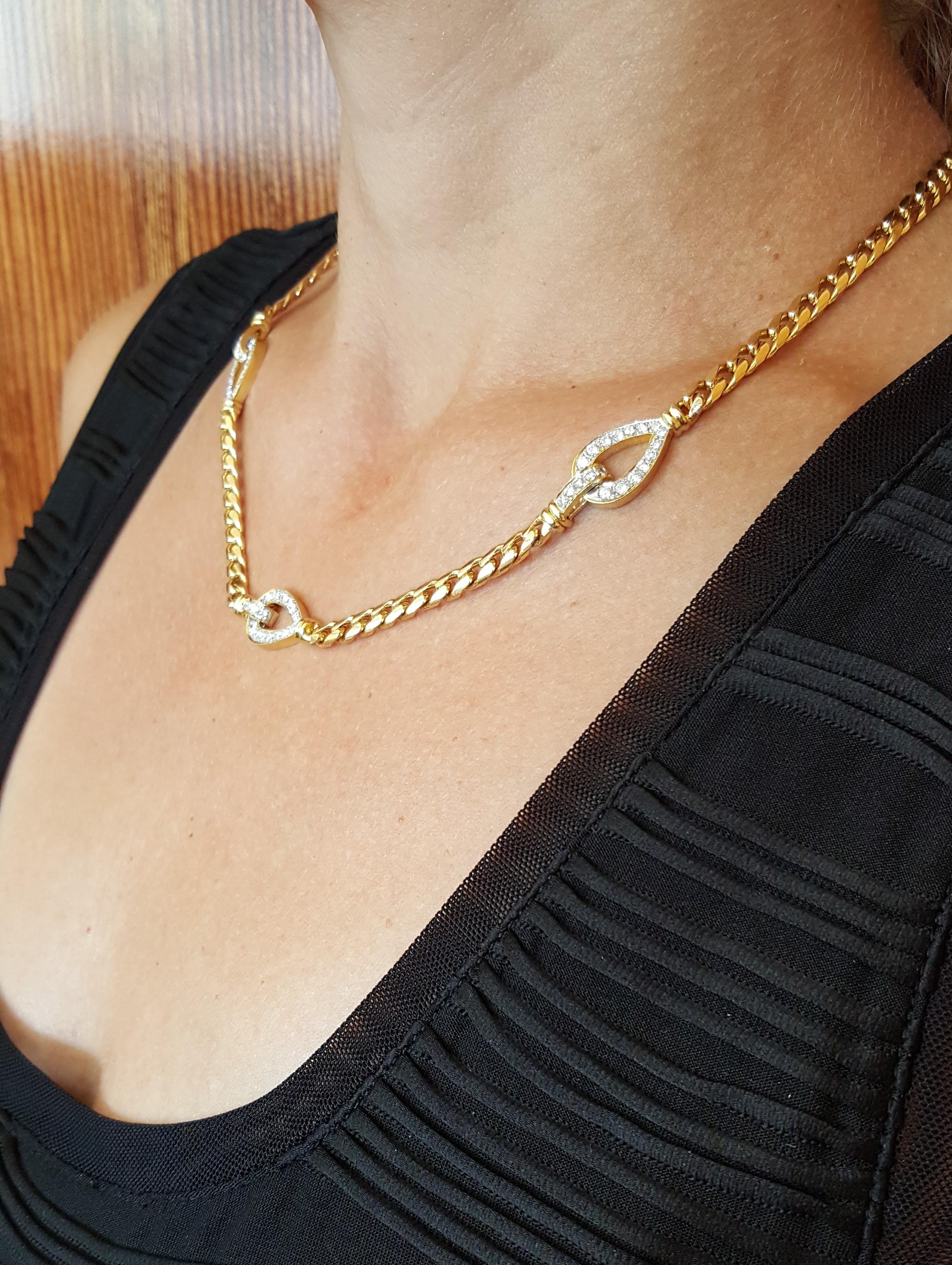 18kt yellow gold 1.77cttw diamond curb-link 19-inch necklace (diamond weight is a close approximation-based measurement).  The necklace link is solid 18kt gold, 48 grams, 4.8mm wide, stamped 18kt 750, and secured with a fold-clasp and figure-8