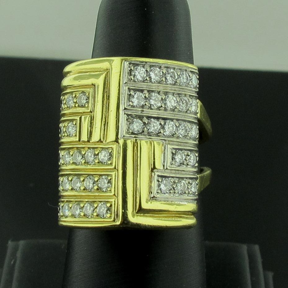 Set in 18 karat yellow gold are 40 round brilliant cut diamonds in a somewhat geometric style, weighing 1.50 carats in total diamond weight.  Color is G, Clarity is VS.  Gold weight is 17 grams.  Ring size is 8.5.