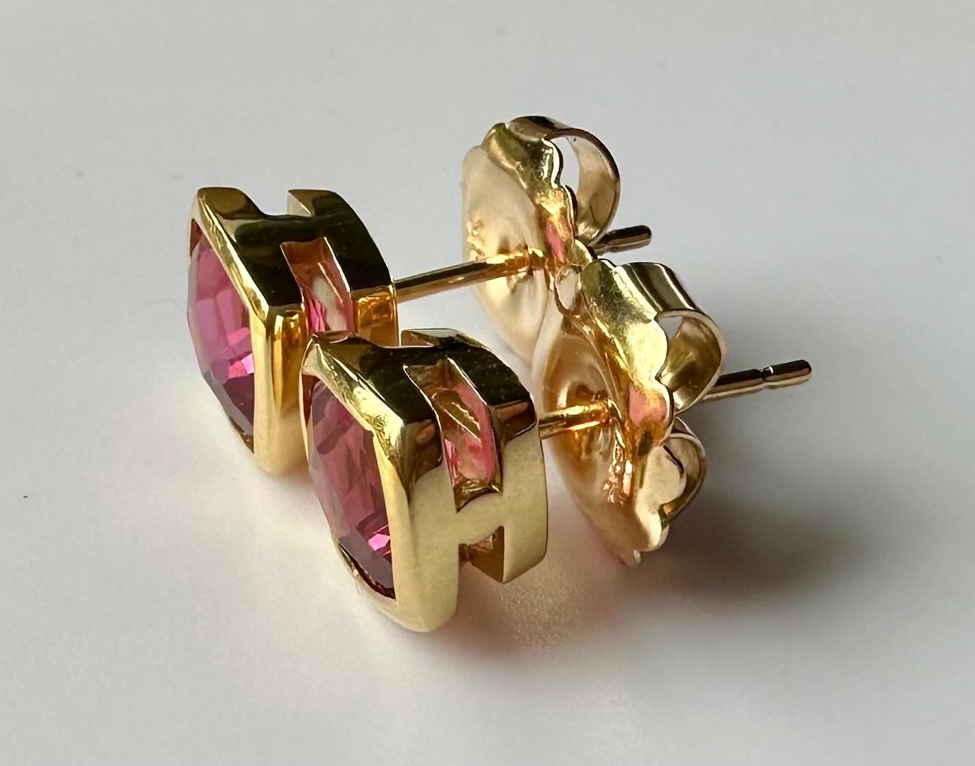 Contemporary 18kt Yellow Gold Earrings set with Cushion Cut Shocking Pink Tourmaline. For Sale