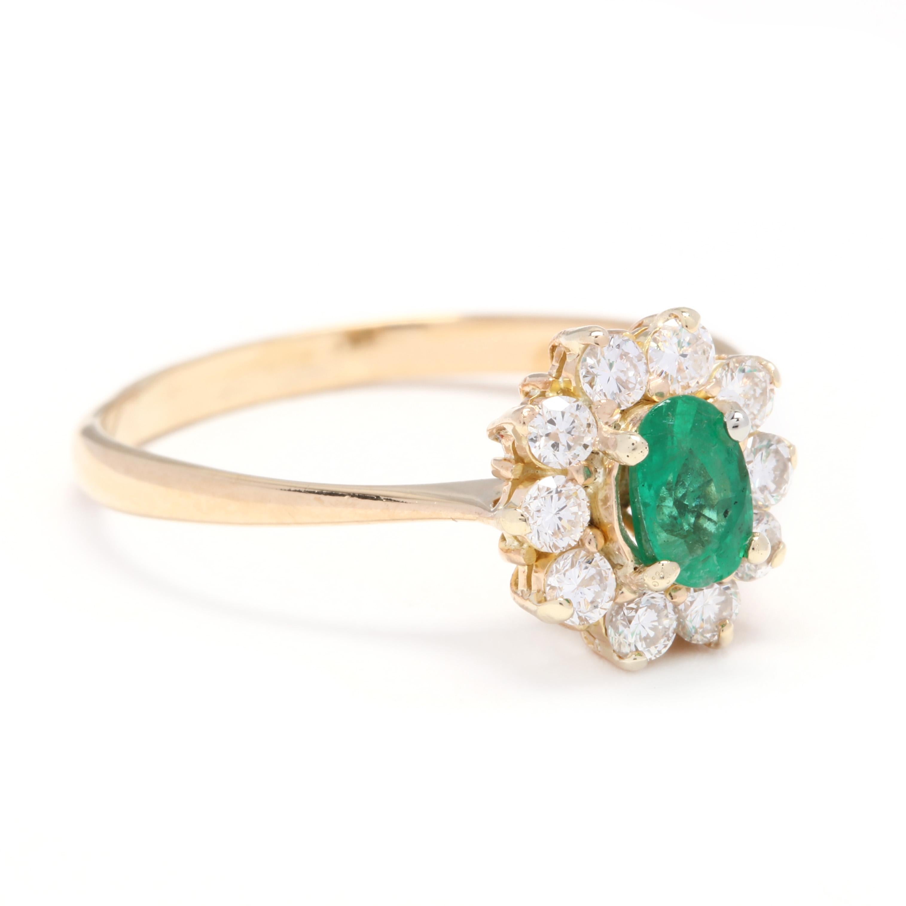 An 18 karat yellow gold, emerald and diamond halo ring. Centering on a prong set, oval cut emerald weighing approximately .35 carat surrounded by round brilliant cut diamonds weighing approximately .42 total carats and thin pinched band.

Stones:
-