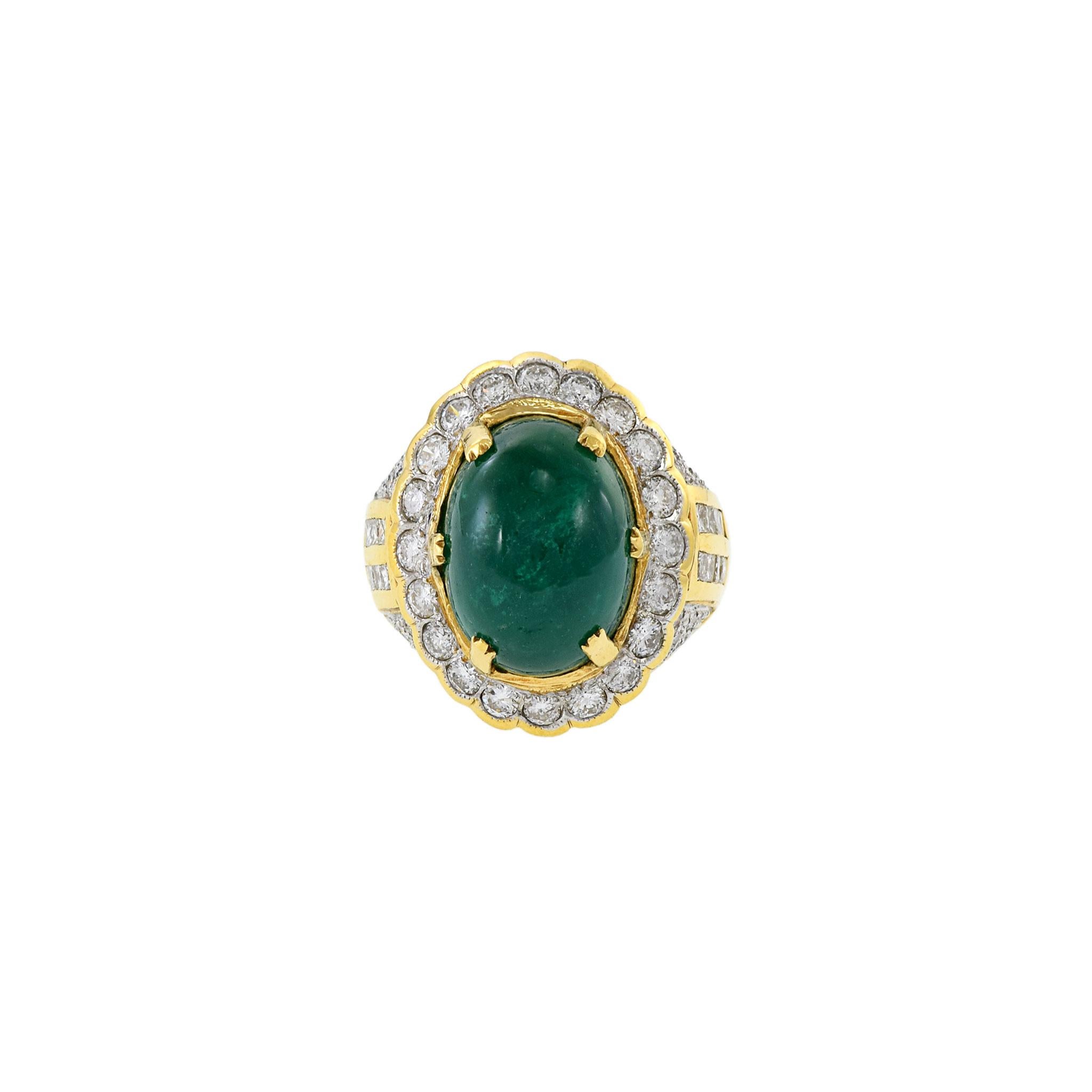 This 18kt yellow gold certified ring contains a large, 9.57ct oval emerald in the center. This is then surrounded by 2.00ct total weight diamonds. Size 6.25 US. Weight 13.5 gm.
