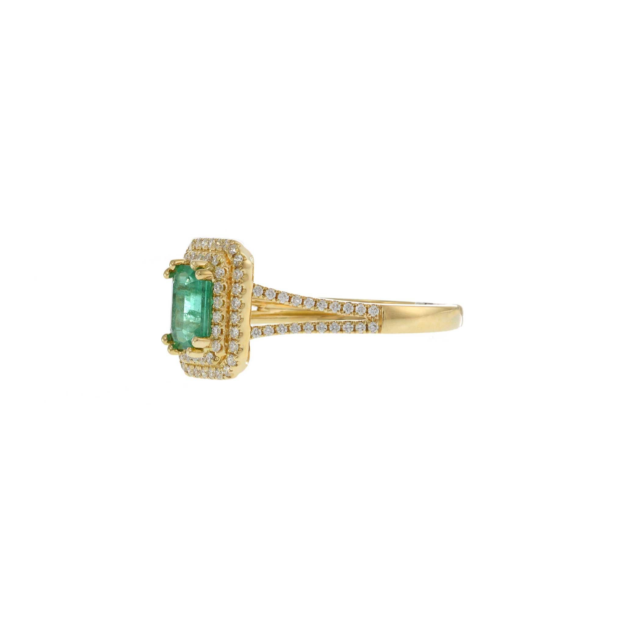 Modern 18KT Yellow Gold Emerald Cut Emerald and Diamond Double Halo Ring For Sale