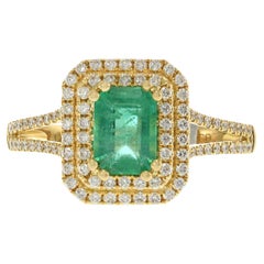 18KT Yellow Gold Emerald Cut Emerald and Diamond Double Halo Ring