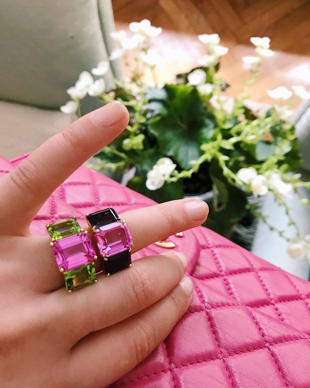 18kt yellow gold Emerald Cut ring with Pink Topaz (approximately 5 cts) and Blue Topaz (approximately 4 cts each).

The Ring measures approximately 1 