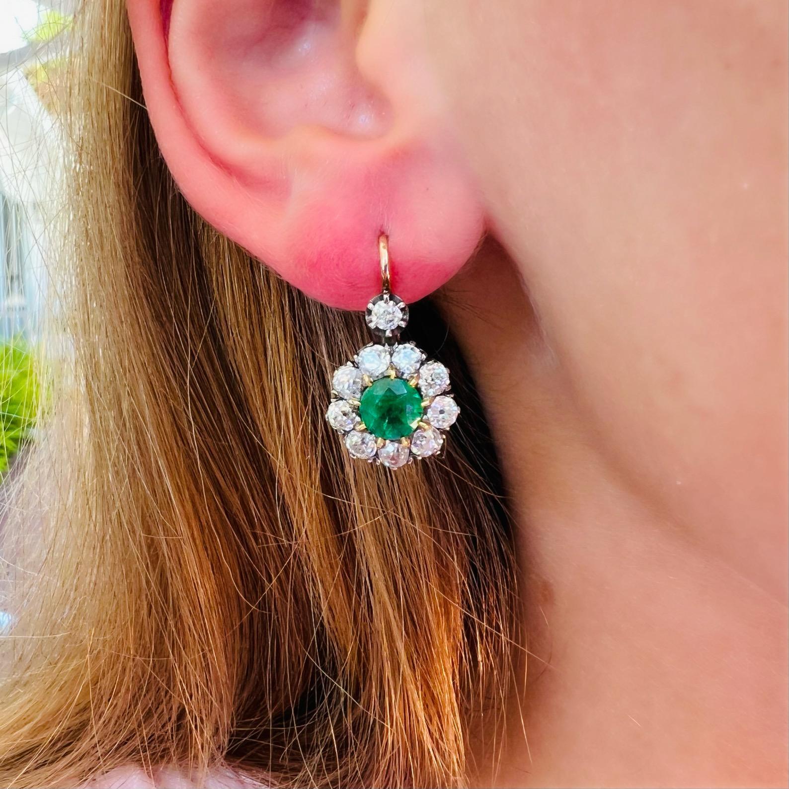 Stop the press: the perfect emerald and diamond earrings may have just arrived! This 18 karat gold stunners feature two vibrant emeralds weighing a total of 1.75 carats, each surrounded by a halo of fine white natural diamonds weighing a significant