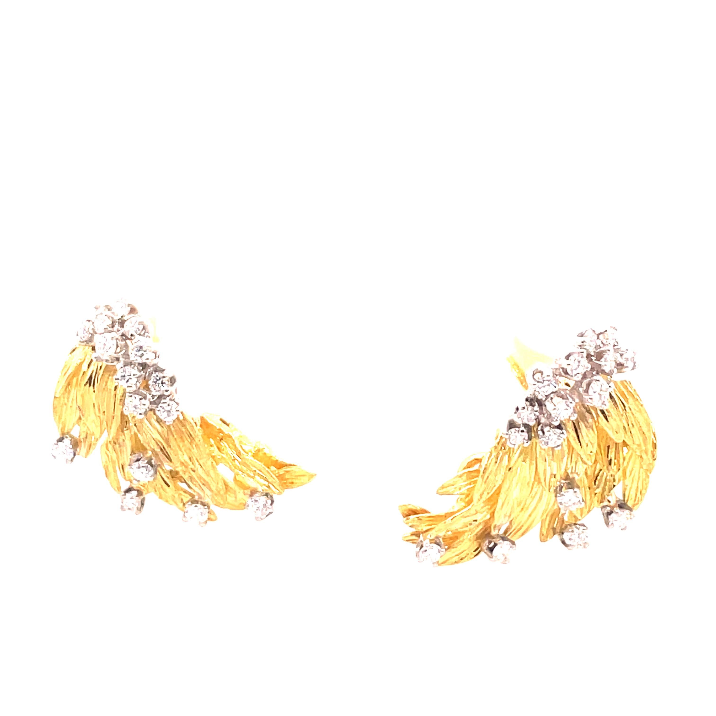 18kt yellow gold earrings with gorgeous diamonds scattered through out with omega backs.
These earrings sit perfectly on the ear and the diamonds sparkle in the light. 
Great day to evening choice.