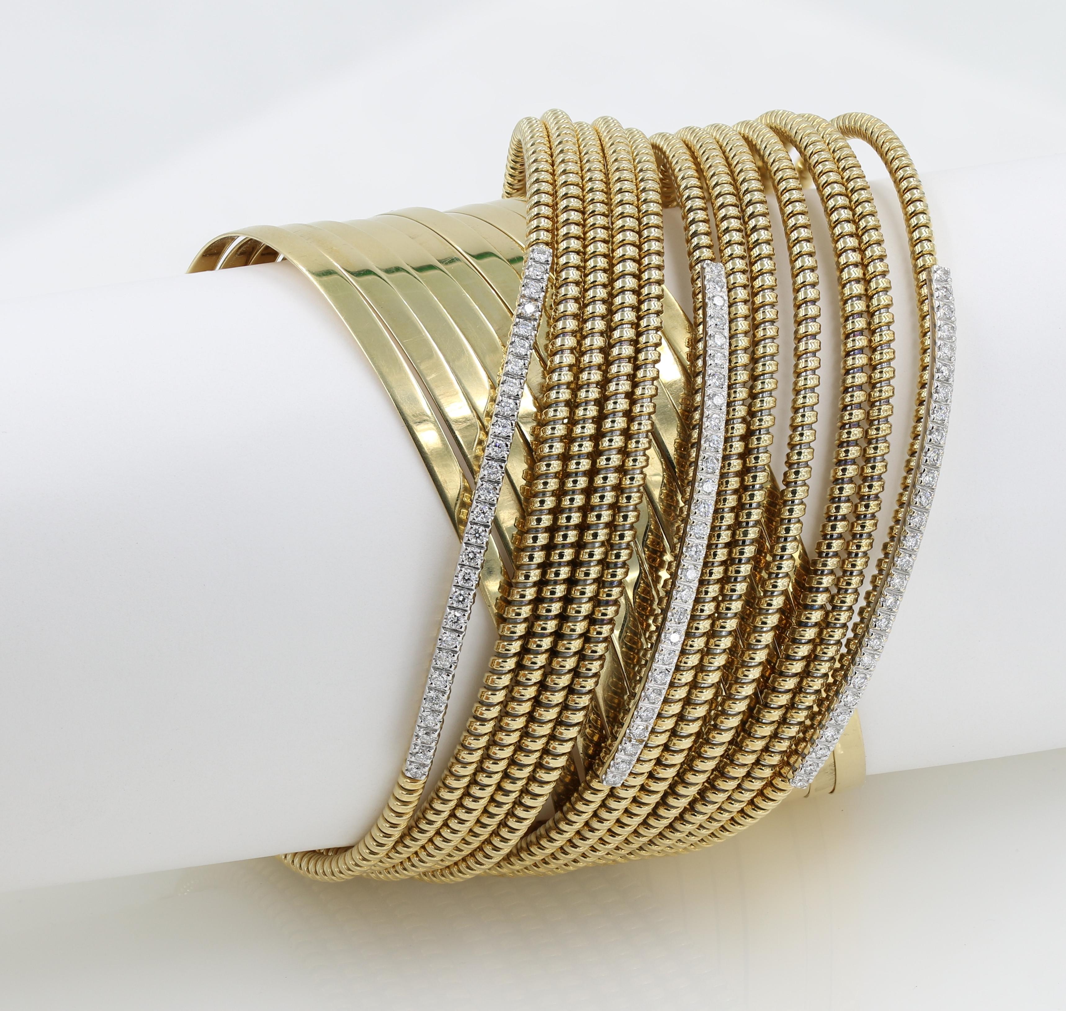 18kt Yellow gold flexible wide bracelet with diamonds, features 81 Natural round cut diamonds (GH - VS) weighing 1.21cts total. Bracelet weighs over 63 DWT. 