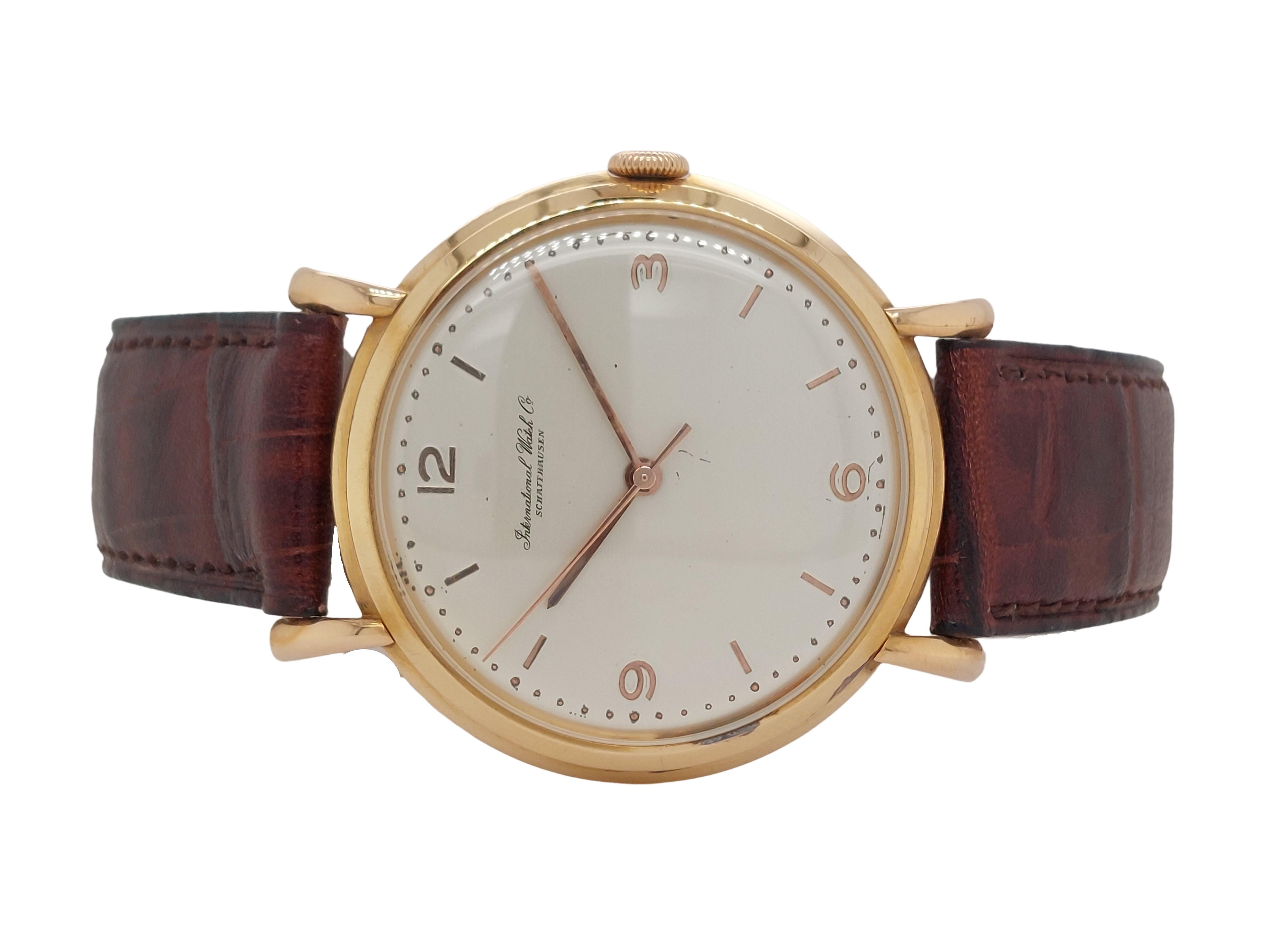 18Kt Yellow Gold IWC Wrist Watch, Caliber 89, Diameter 36.5mm

Calber: 89

Movement: Manual winding

Functions: Hours, minutes

Case: 18kt Yellow gold case 36.5mm x 9mm 

Dial: Goldish dial with Arabic numerals

Strap: Brown leather strap, with
