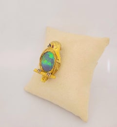 18 Karat Yellow Gold King Puffin Brooch with 12.44 Carat Black Opal Center