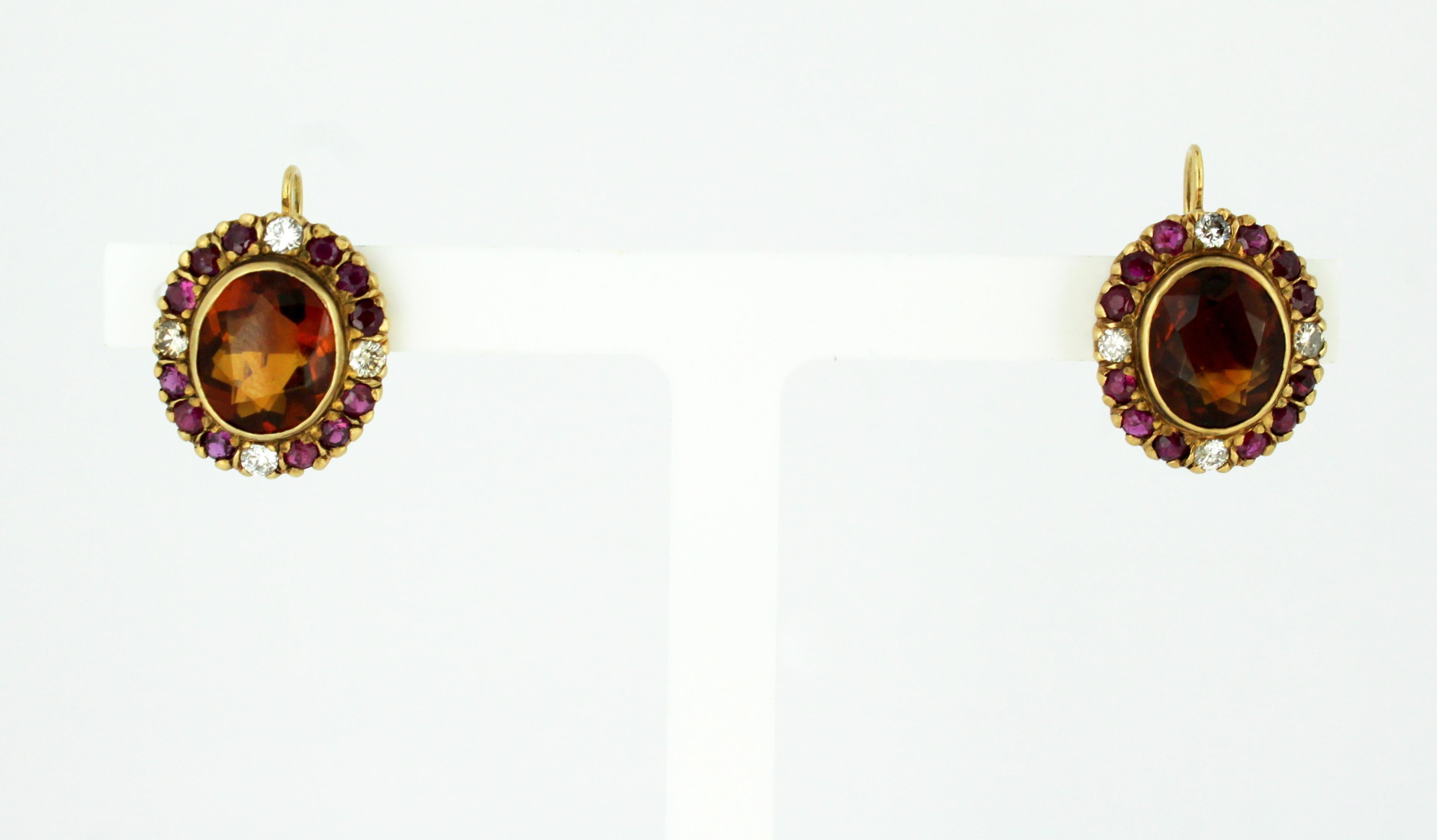 18kt yellow gold ladies clip-on earrings with garnets, diamonds and rubies.
Circa 1970s
Tested positive for 18kt gold.

Approx Dimensions - 
Size : 2.4 x 1.6 x 1.3 cm
Weight : 8 grams total

Diamonds - 
Cut : Round
Number of diamonds : 8