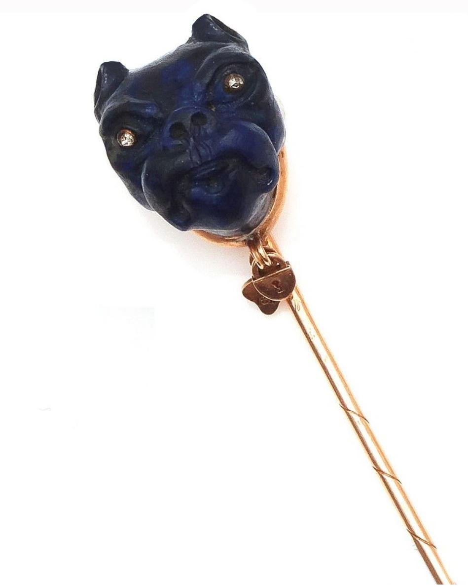 

Yellow gold pin patterned with lapis lazuli bulldog's head, the eyes with rose cut diamonds.
Weight: 9,4gr