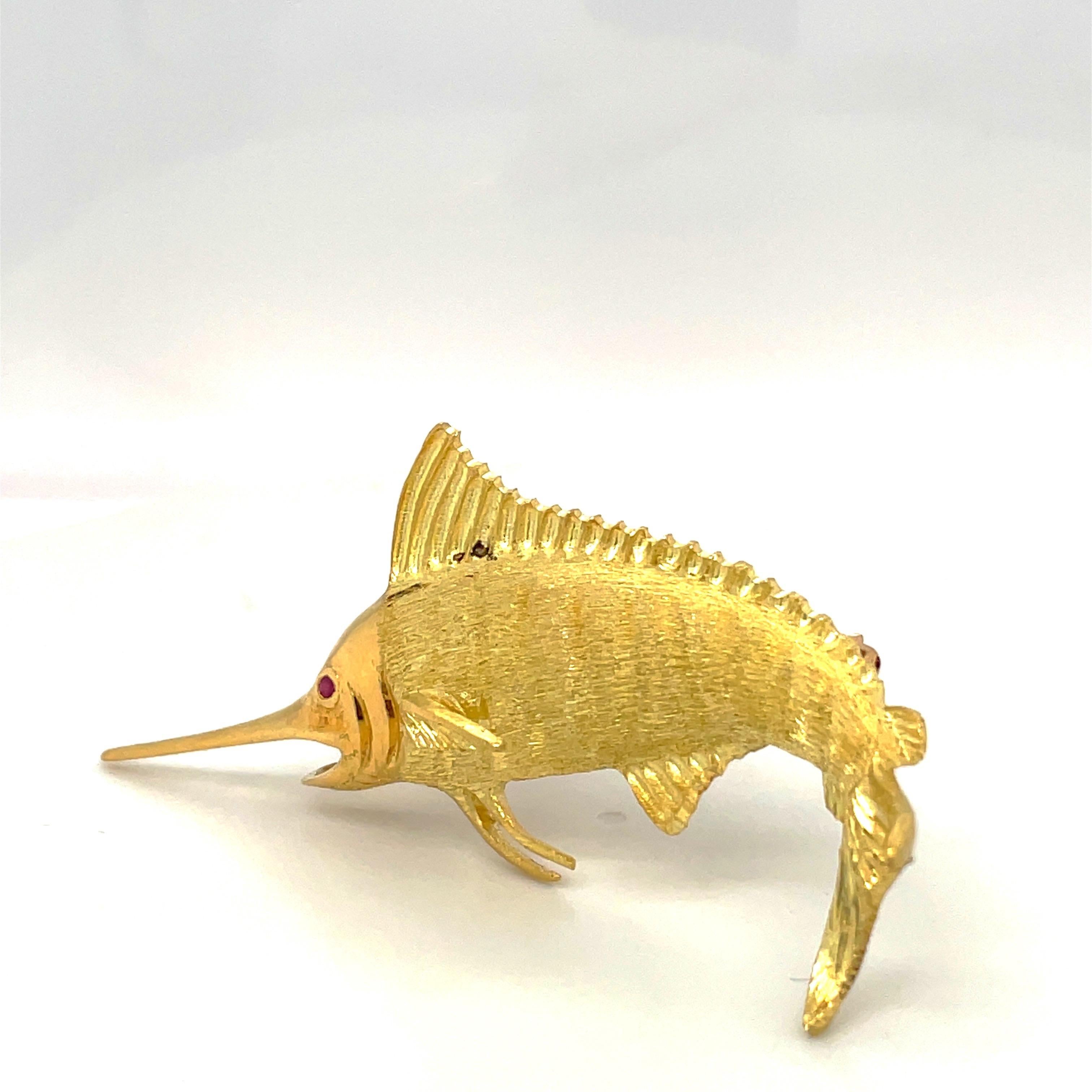 Gone fishing lately? No? Neither have we but bring the ocean home with this stunning marlin brooch. Made in 1996 this exquisite 18kt gold fish has a variety of textures which helps bring him to life. 
About 2.75