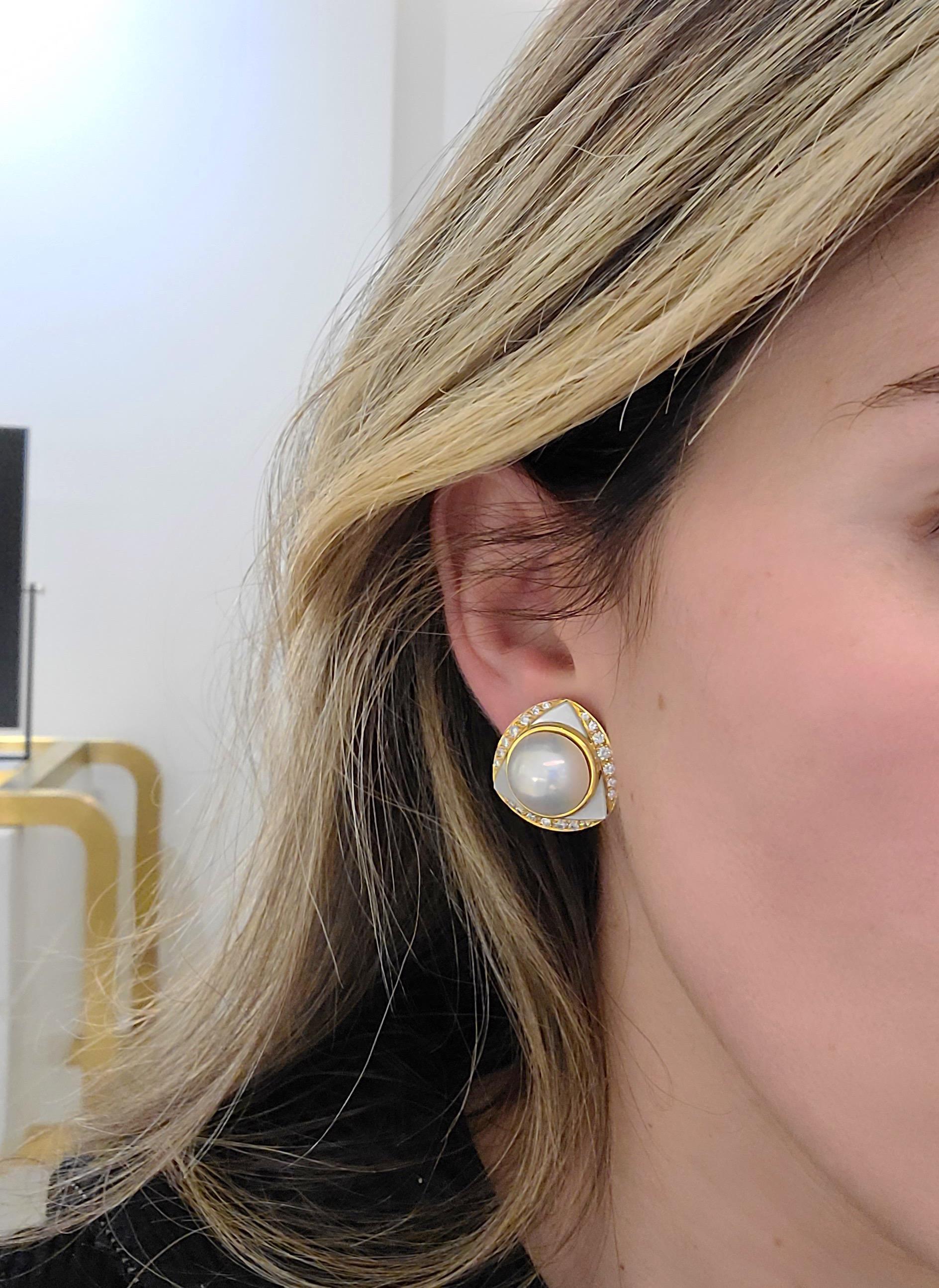 Cellini Jewelers NYC, 18KT Yellow Gold Earrings feature two Mabe Pearl Centers surrounded with Mother of pearl in a triangle shape, which is further surrounded with 1.06Ct of round brilliant diamonds. The Gorgeous combination of pearls and Geometric