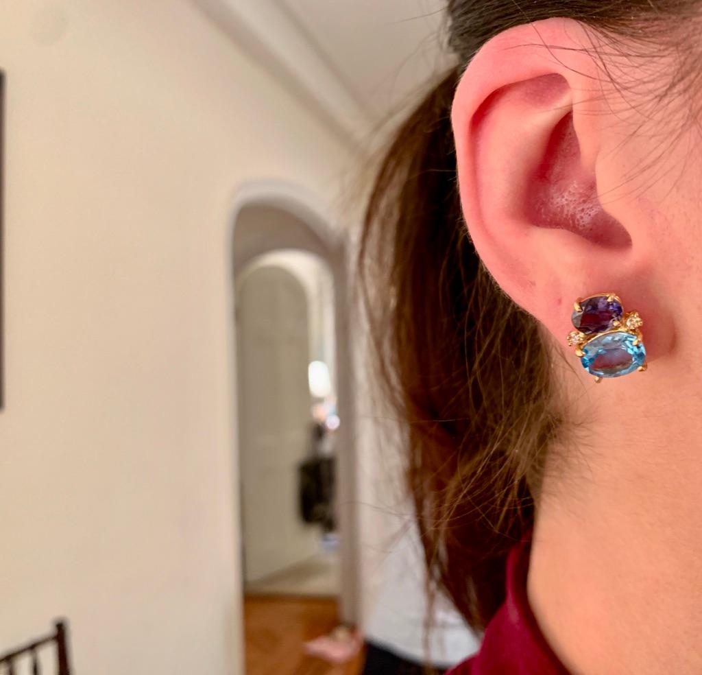 Mini 18kt Yellow Gold GUM DROP™ earrings with faceted Iolite (approximately 2 cts each), Faceted Pale Blue Topaz (approximately 3 cts each), and 4 diamonds weighing ~ 0.20 cts. 
Specifications: Height: 5/8